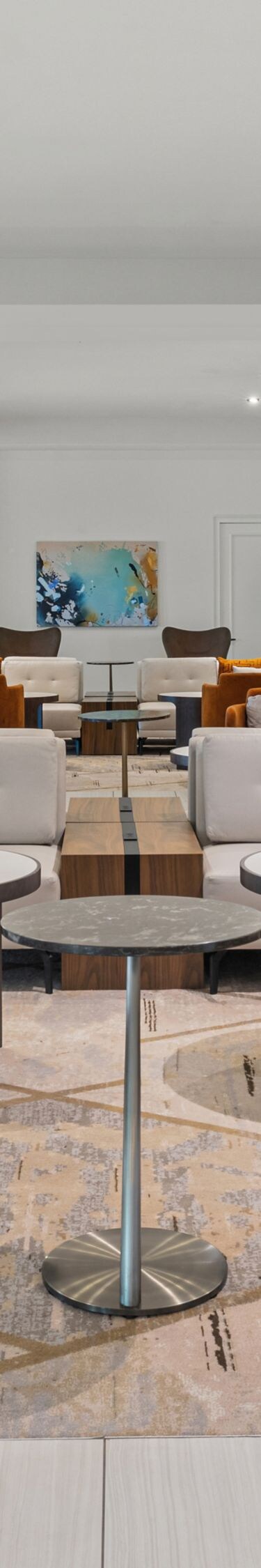 Lobby seating area with chairs and tables