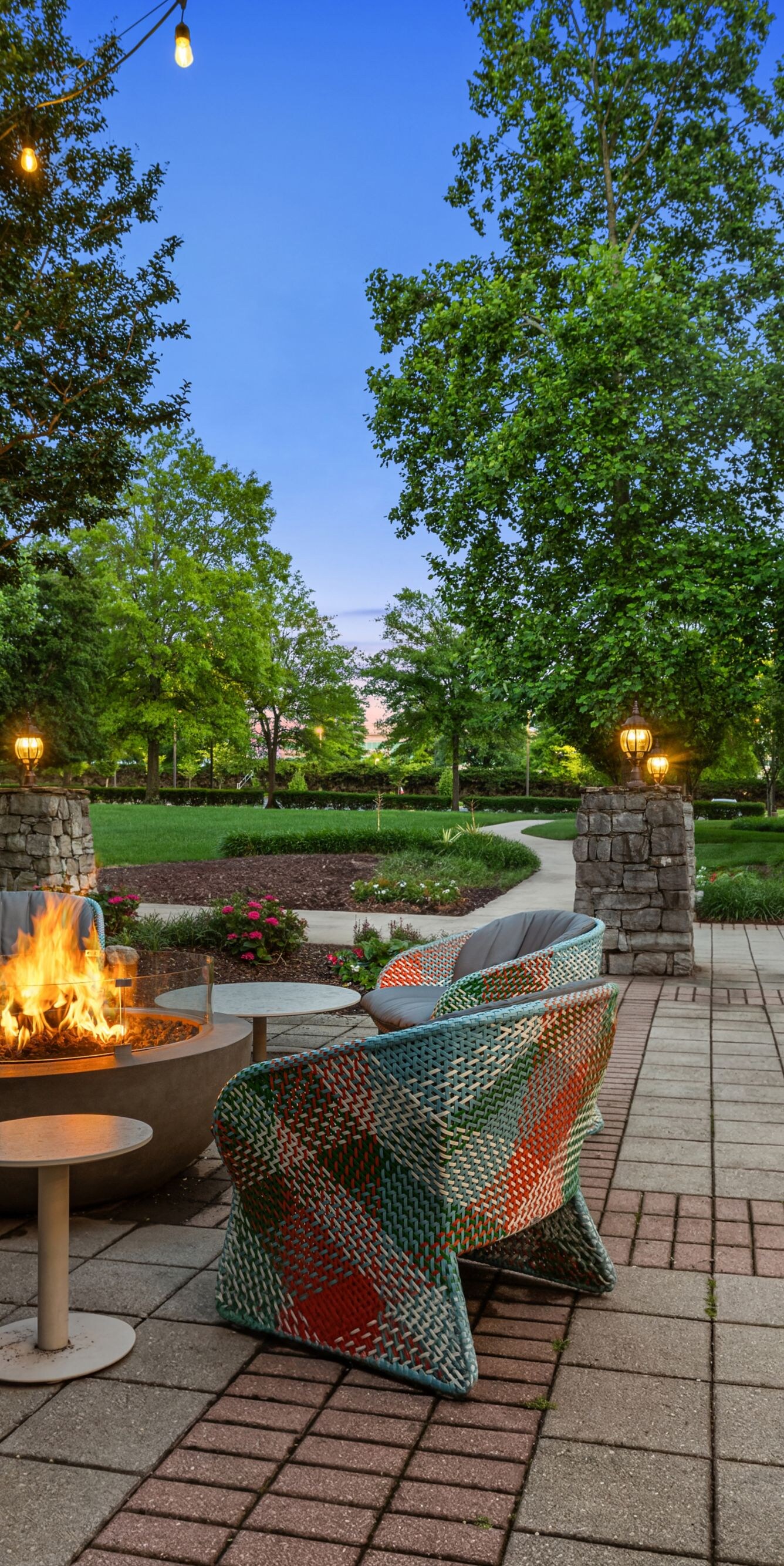 multi colored chairs around fire pit