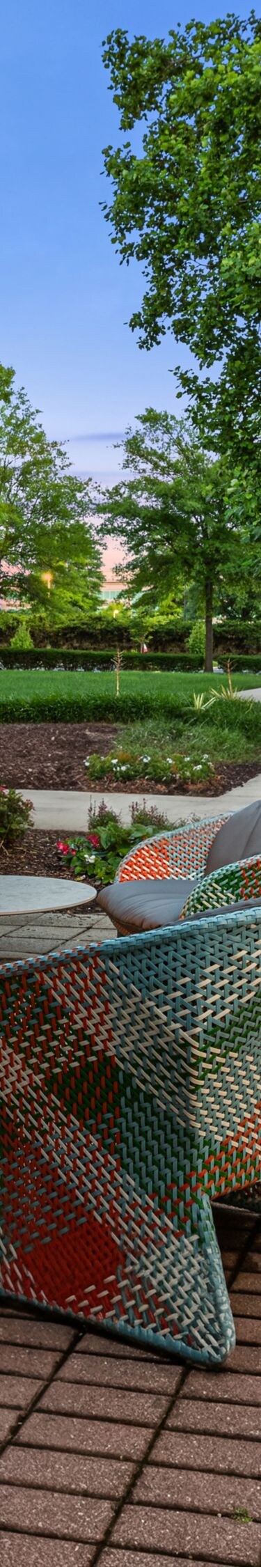 multi colored chairs around fire pit