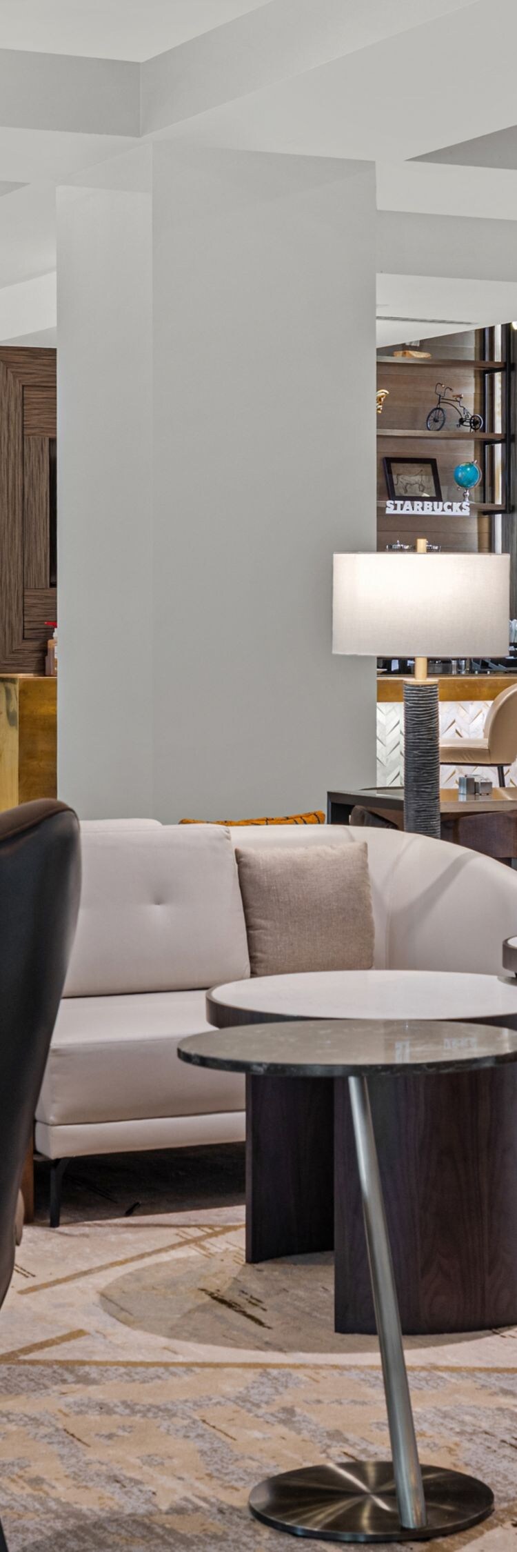 couches and chairs with a bar in the background