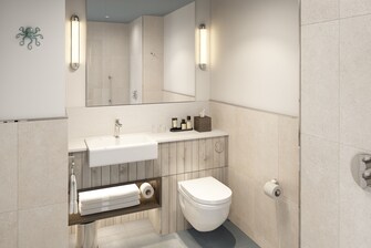Bathroom showing mirror and sink