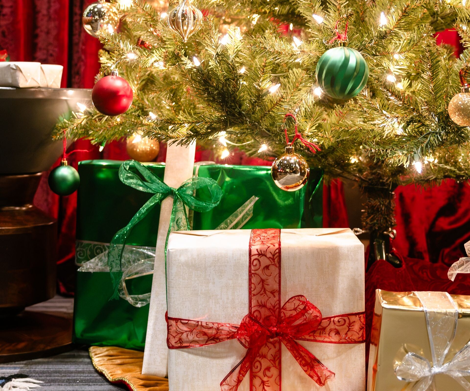 Wrapped gifts beneath holiday tree