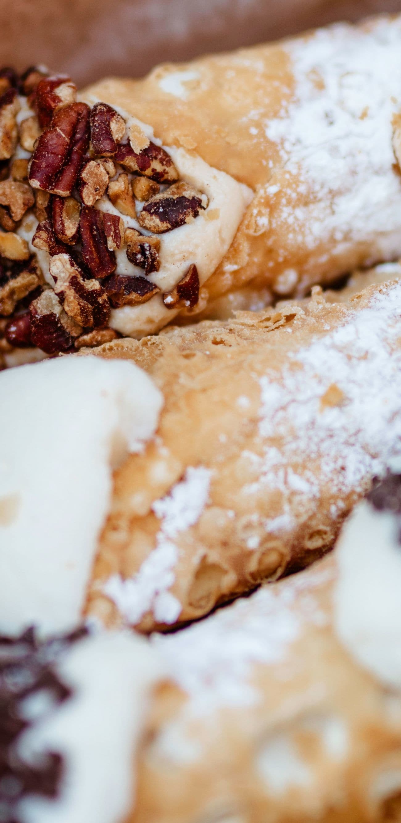 Assorted cannoli in a pastry box