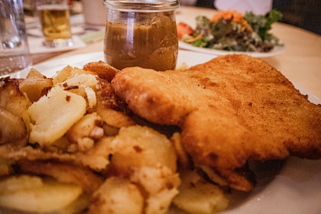 Schnitzel with fried potatoes and mushroom sauce