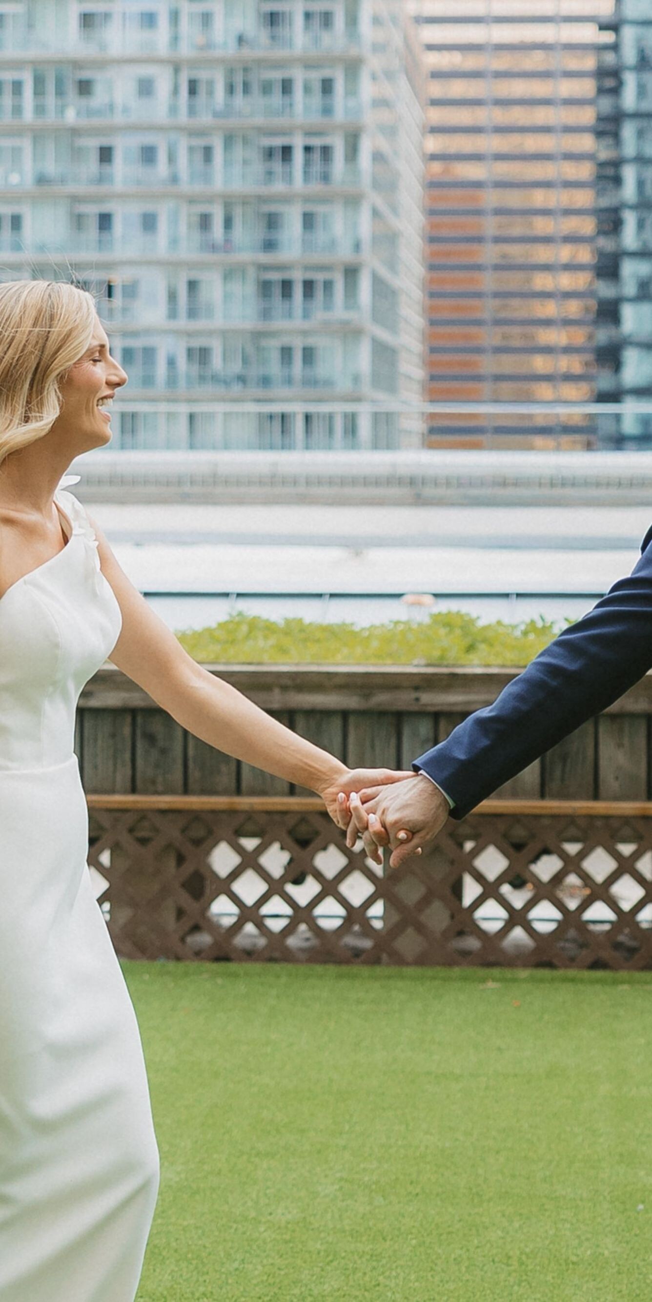 Newlyweds walking on rooftop
