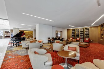 Sweeping lobby area with seating and piano