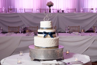 wedding cake in front of head table