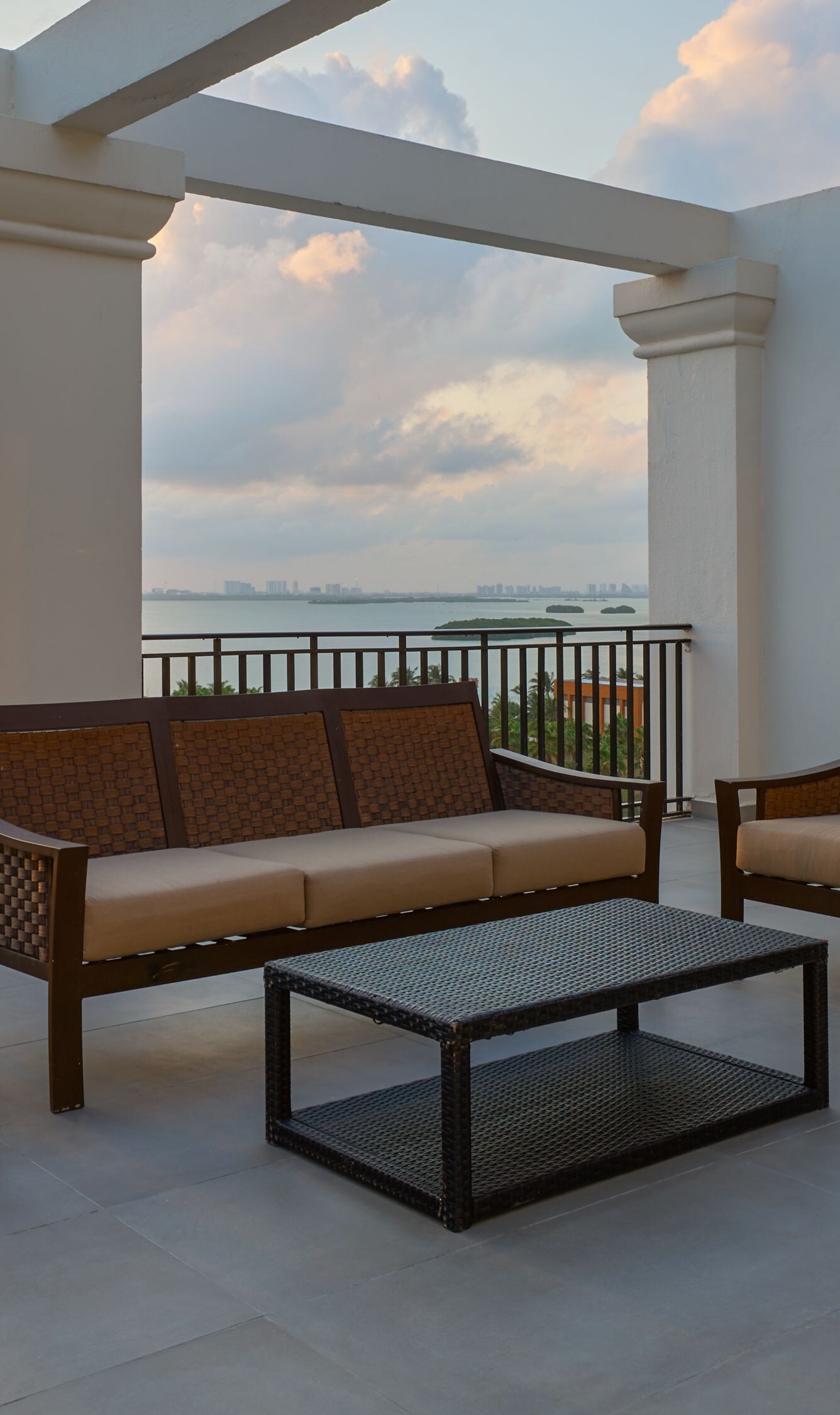 large balcony, seating area, sunset