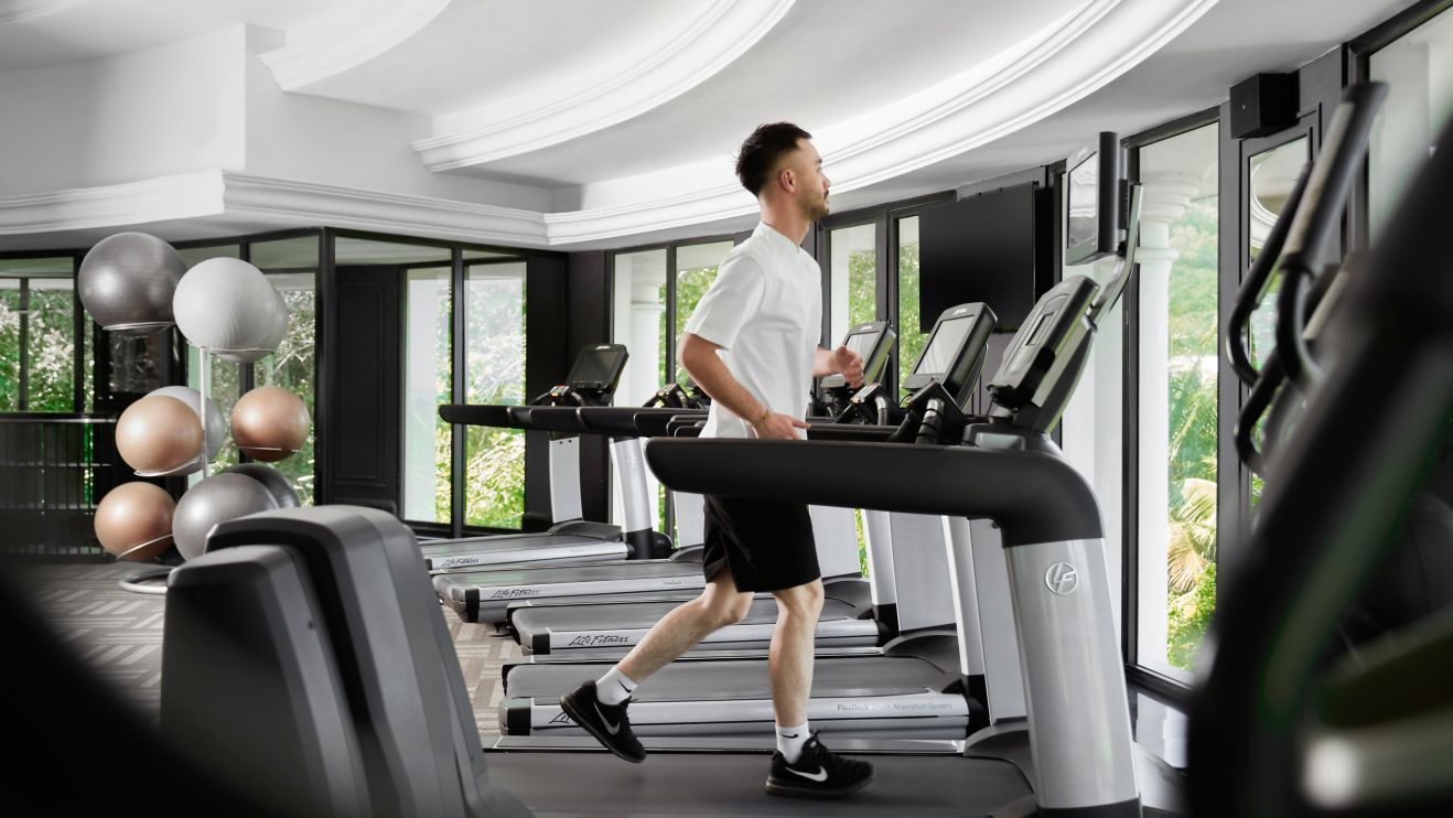 man running on treadmill 