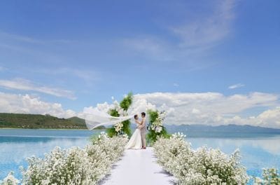 Bride and groom at beach wedding