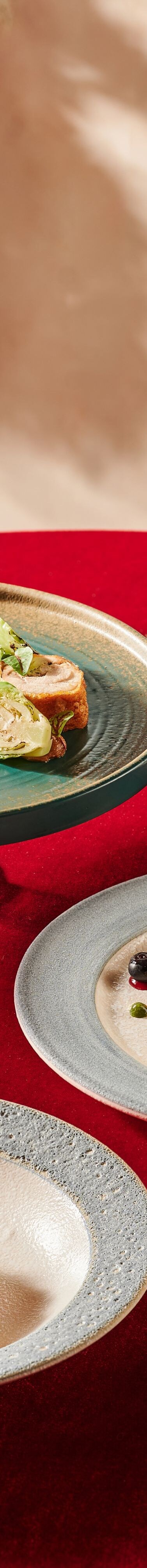 festive dishes, ceramic plates, red table
