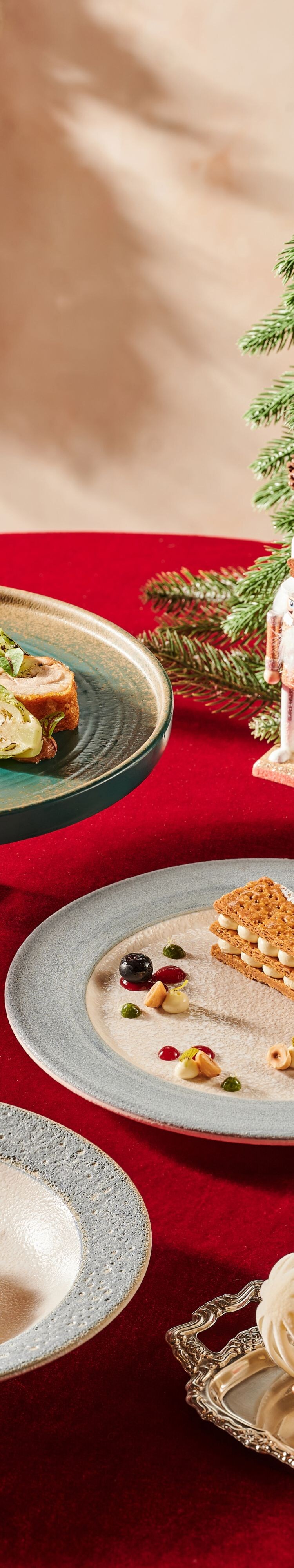 festive dishes, ceramic plates, red table