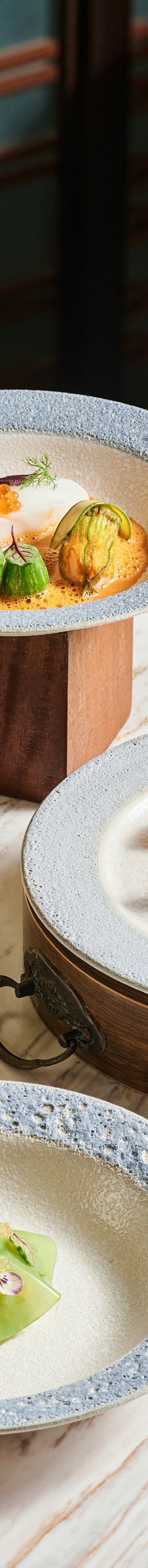 plated dishes, bowls, sauces, cutlery