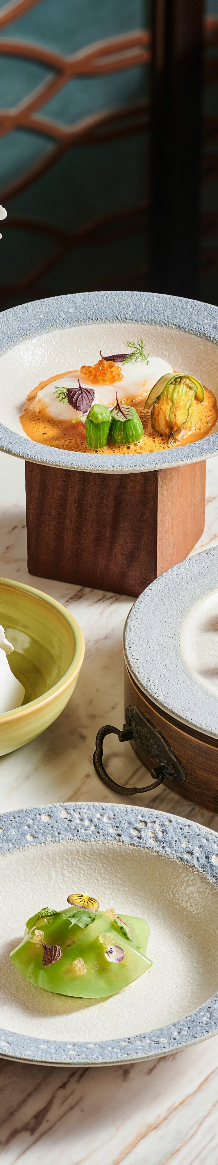 plated dishes, bowls, sauces, cutlery