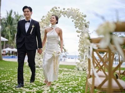 Newly married couple at their Poolside Ceremony