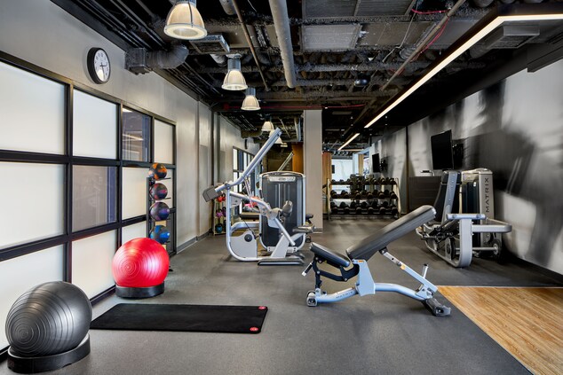 View of fitness center with fitness balls