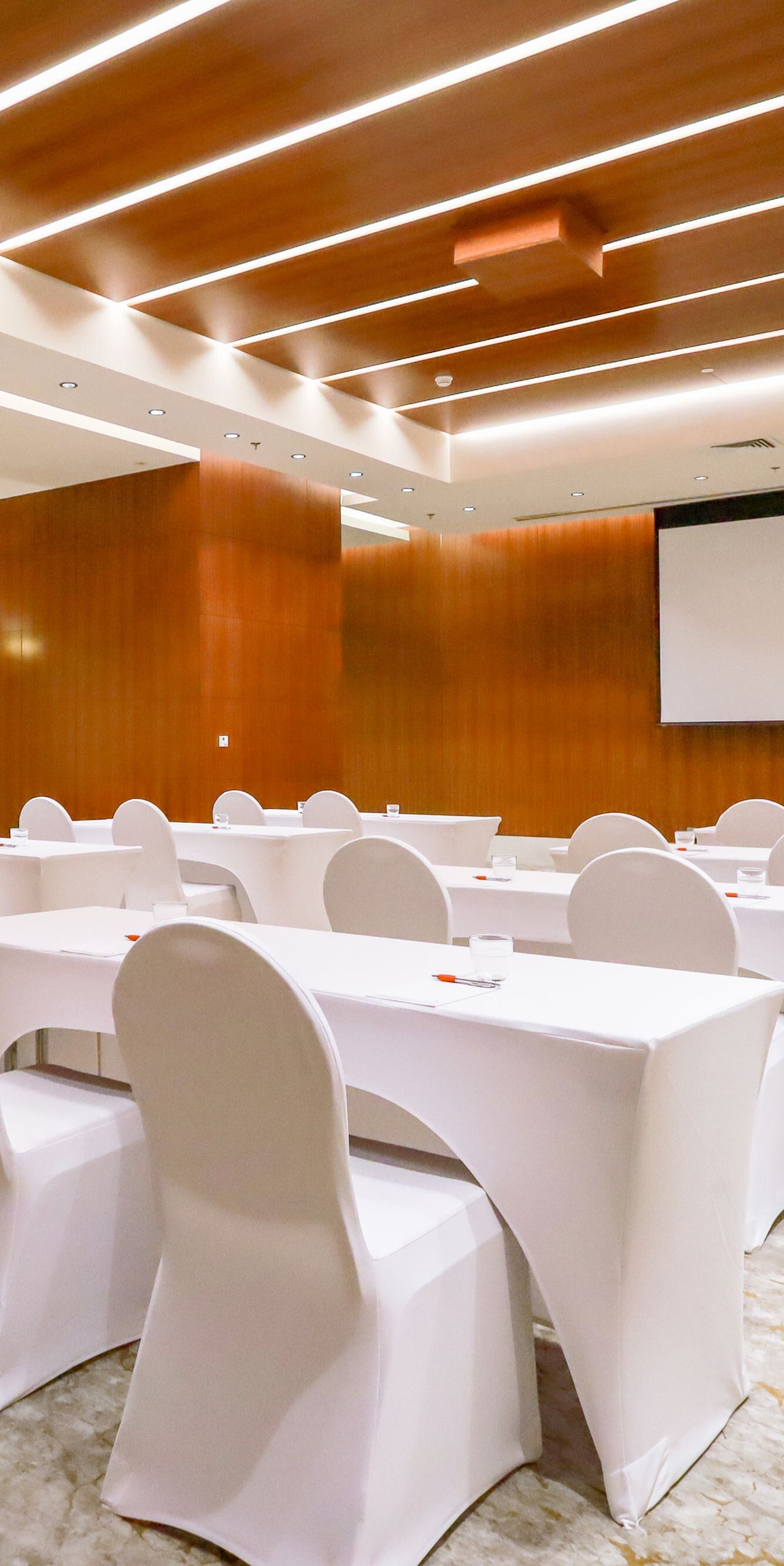 Meeting room with classroom setup and wood