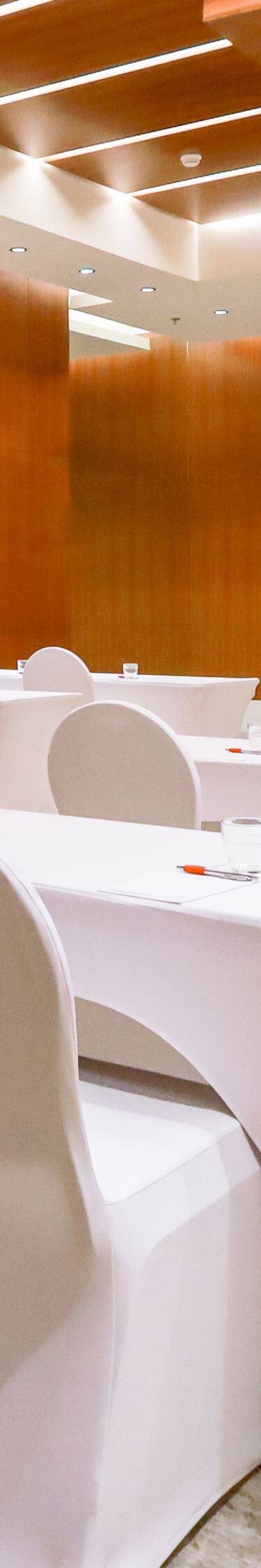 Meeting room with classroom setup and wood