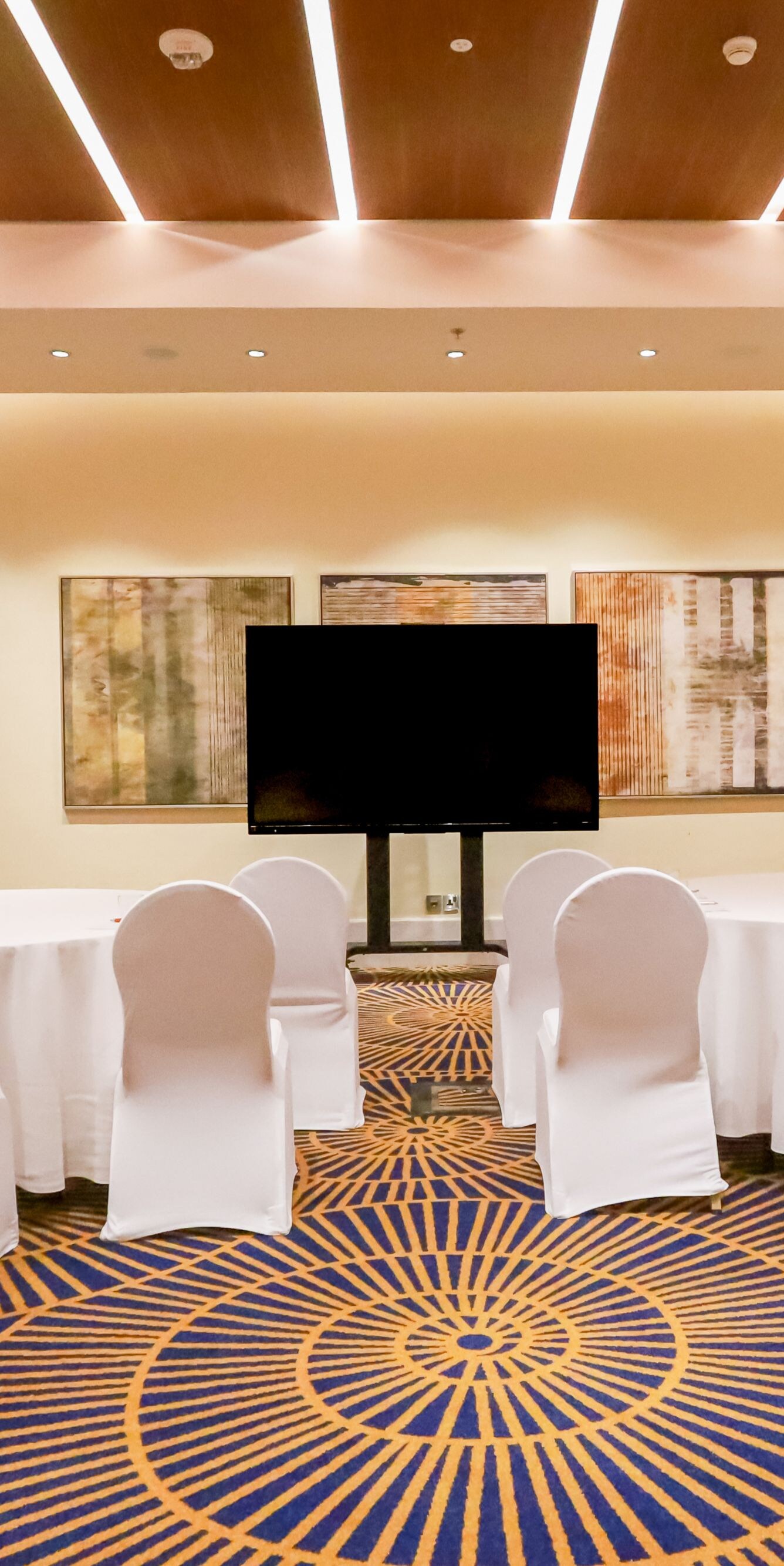 Meeting room with crescent rounds and TV