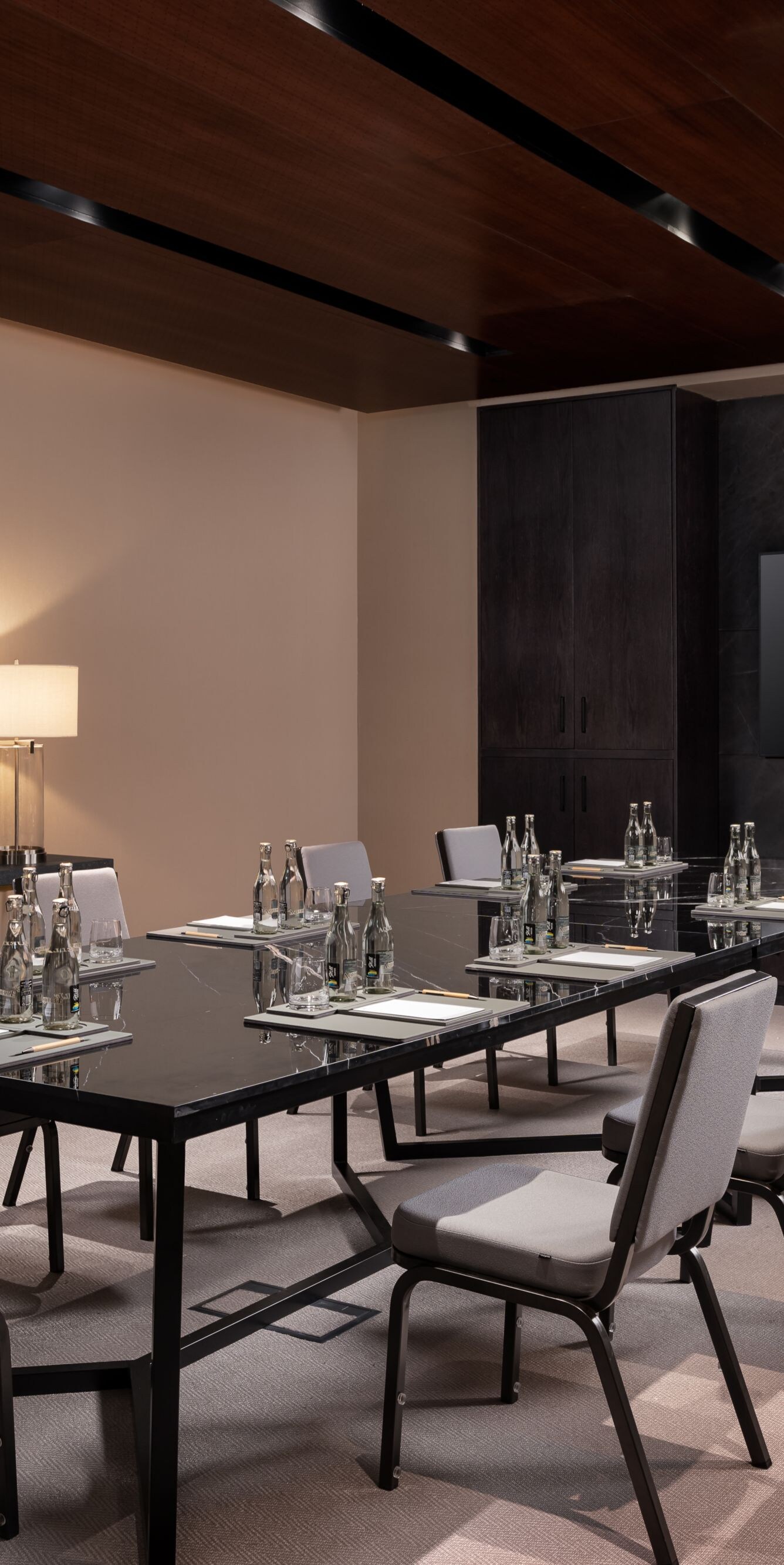 Boardroom with table and wall-mounted TV