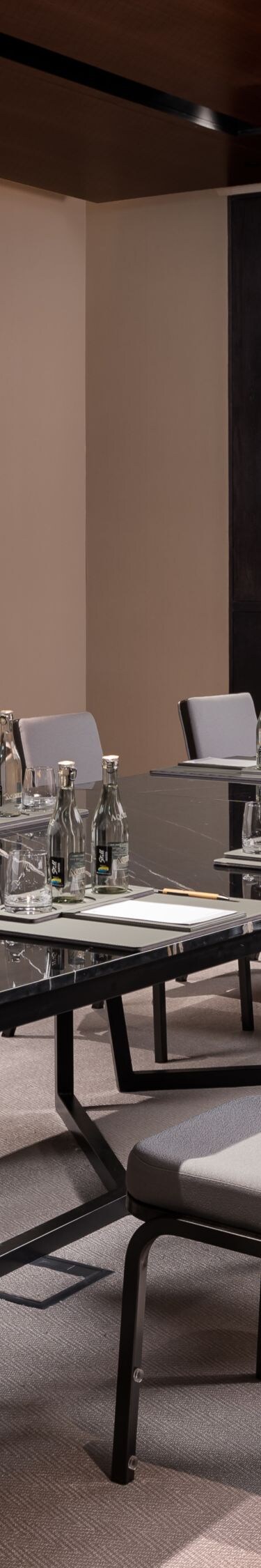 Boardroom with table and wall-mounted TV