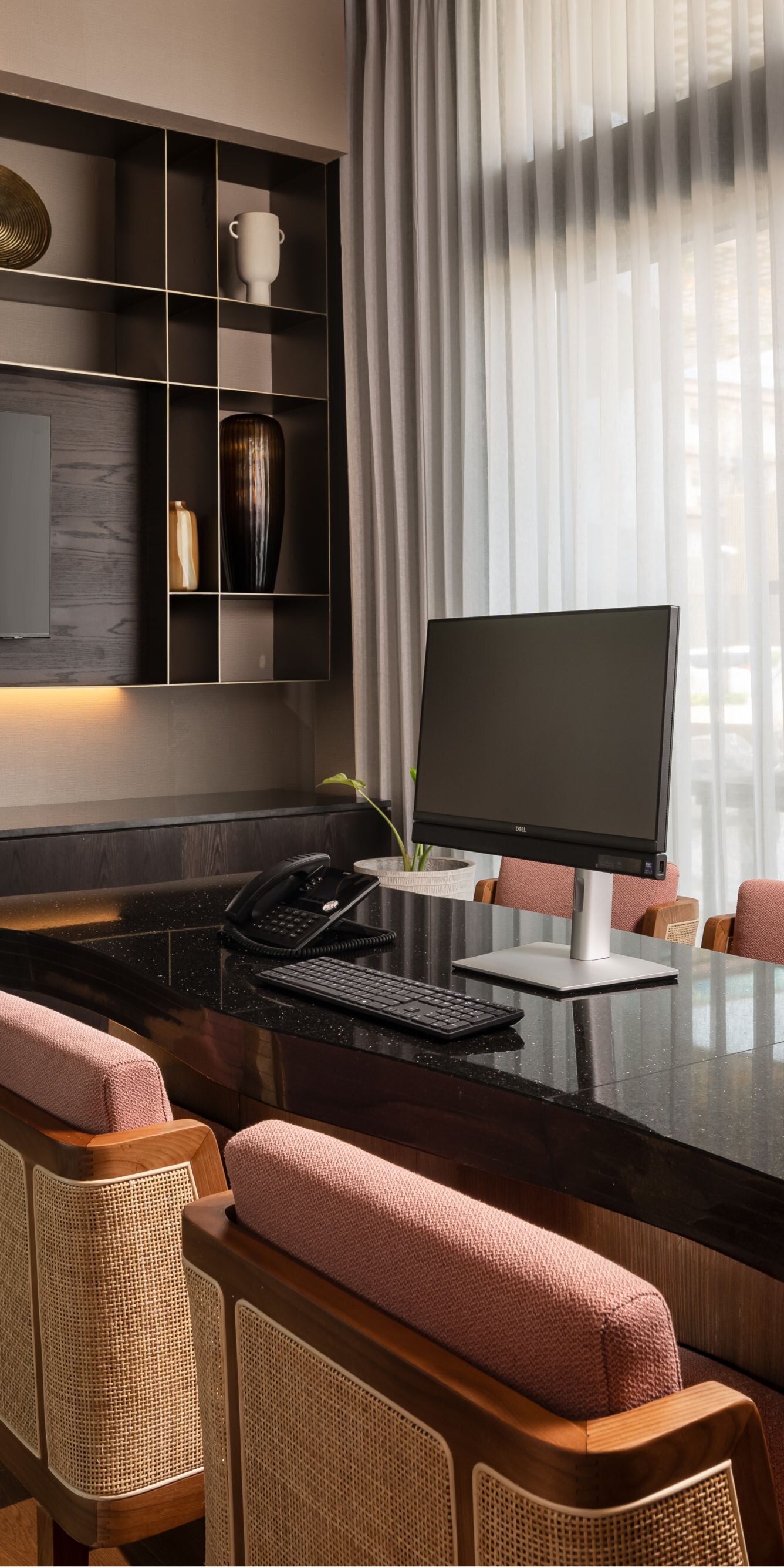 Meeting room with black desk and chairs
