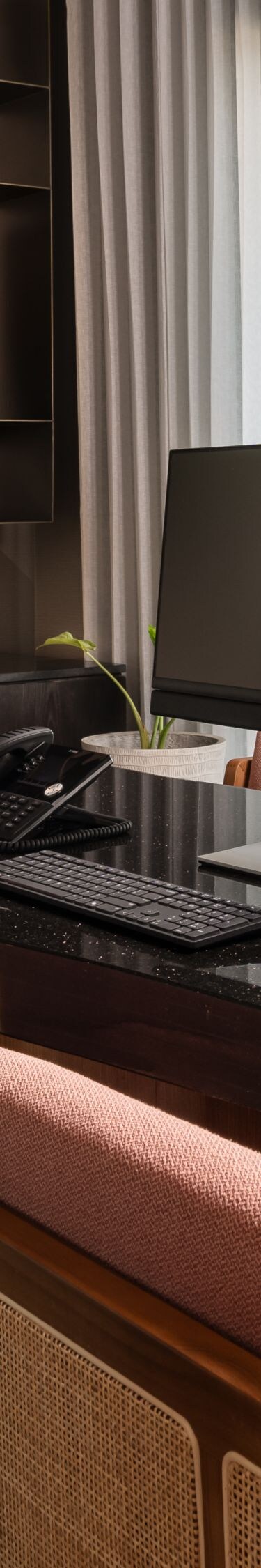 Meeting room with black desk and chairs