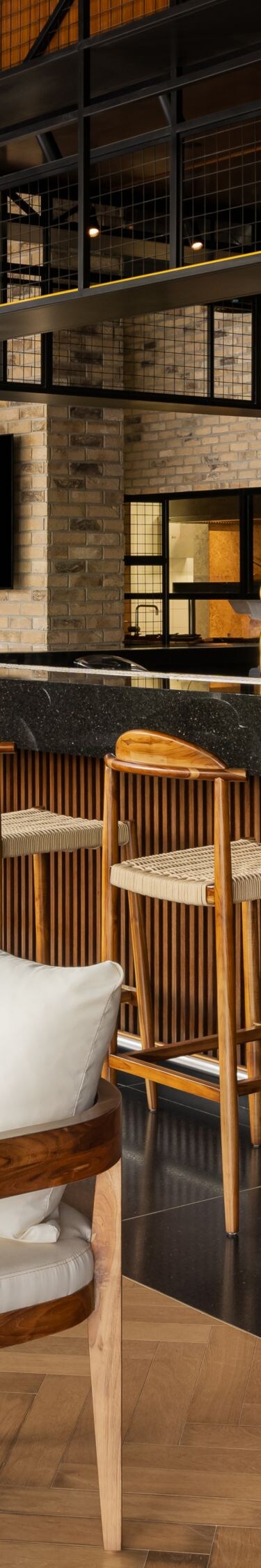 Modern bar with wood stools and brick walls