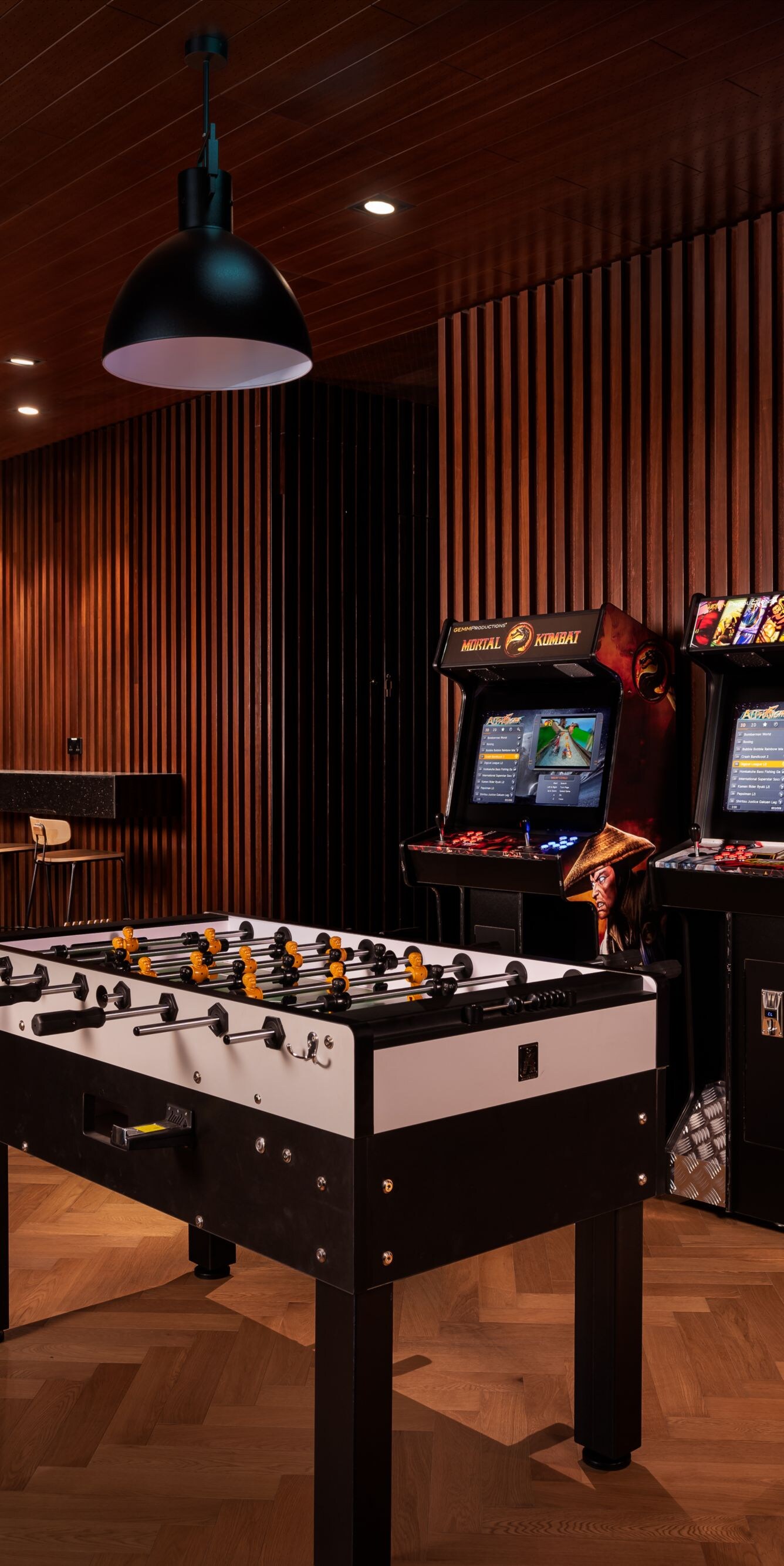 Game room with pool table and arcade games
