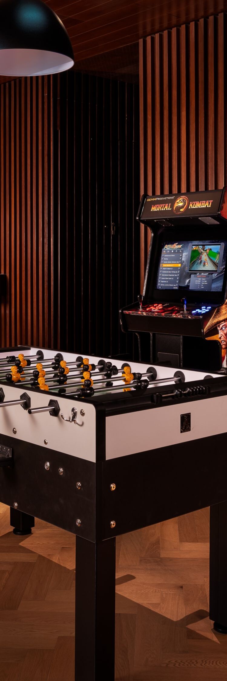 Game room with pool table and arcade games