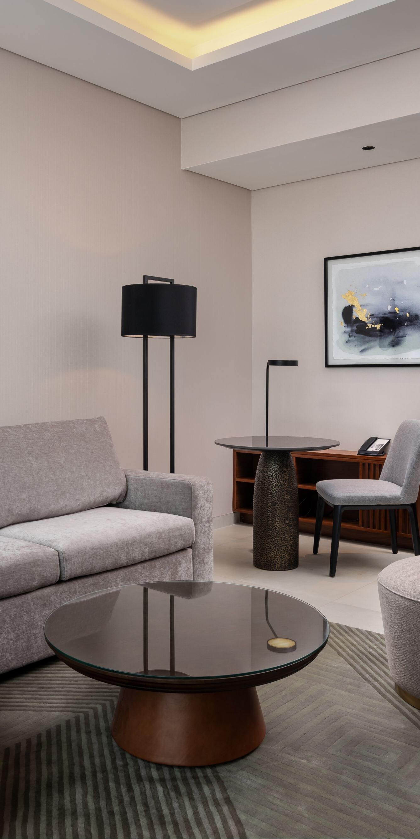 Suite living area with sofa and desk