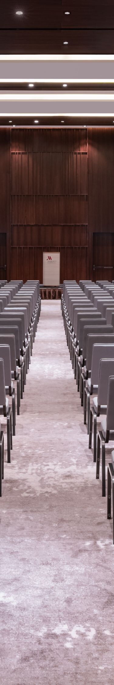 Ballroom with theater seating and podium