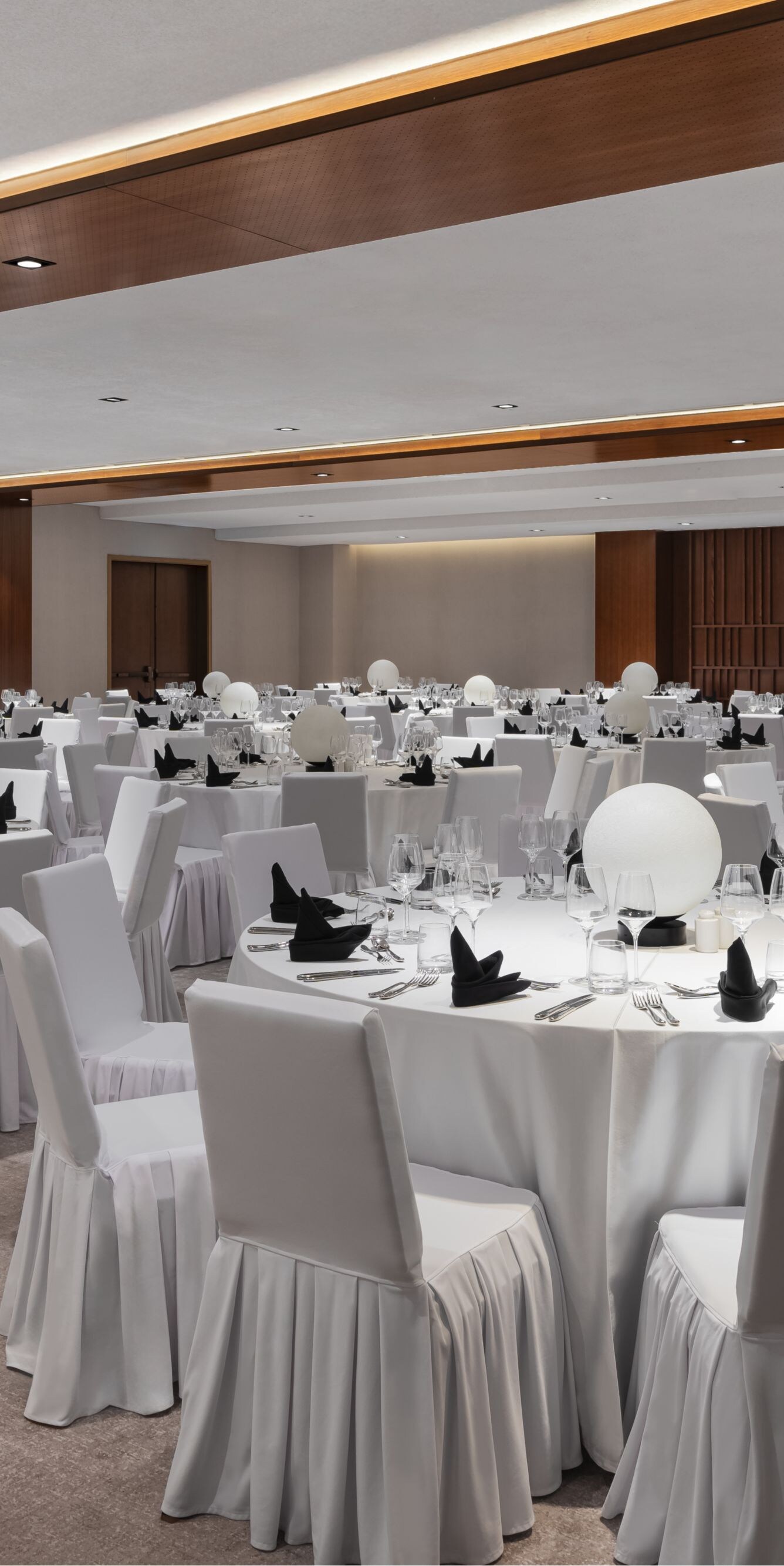 Ballroom with banquet setup and lighting