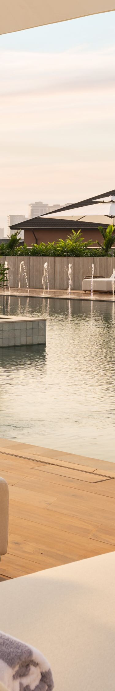 Outdoor pool with lounge chairs and umbrellas