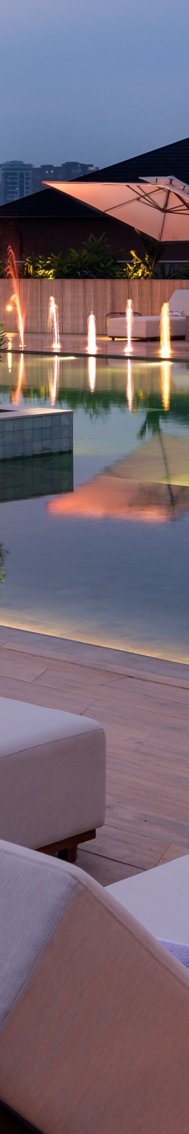 Rooftop pool with fountains and city views