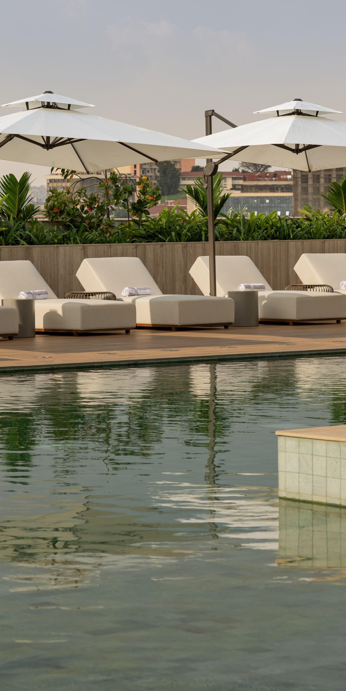 Outdoor pool with lounge chairs and umbrellas