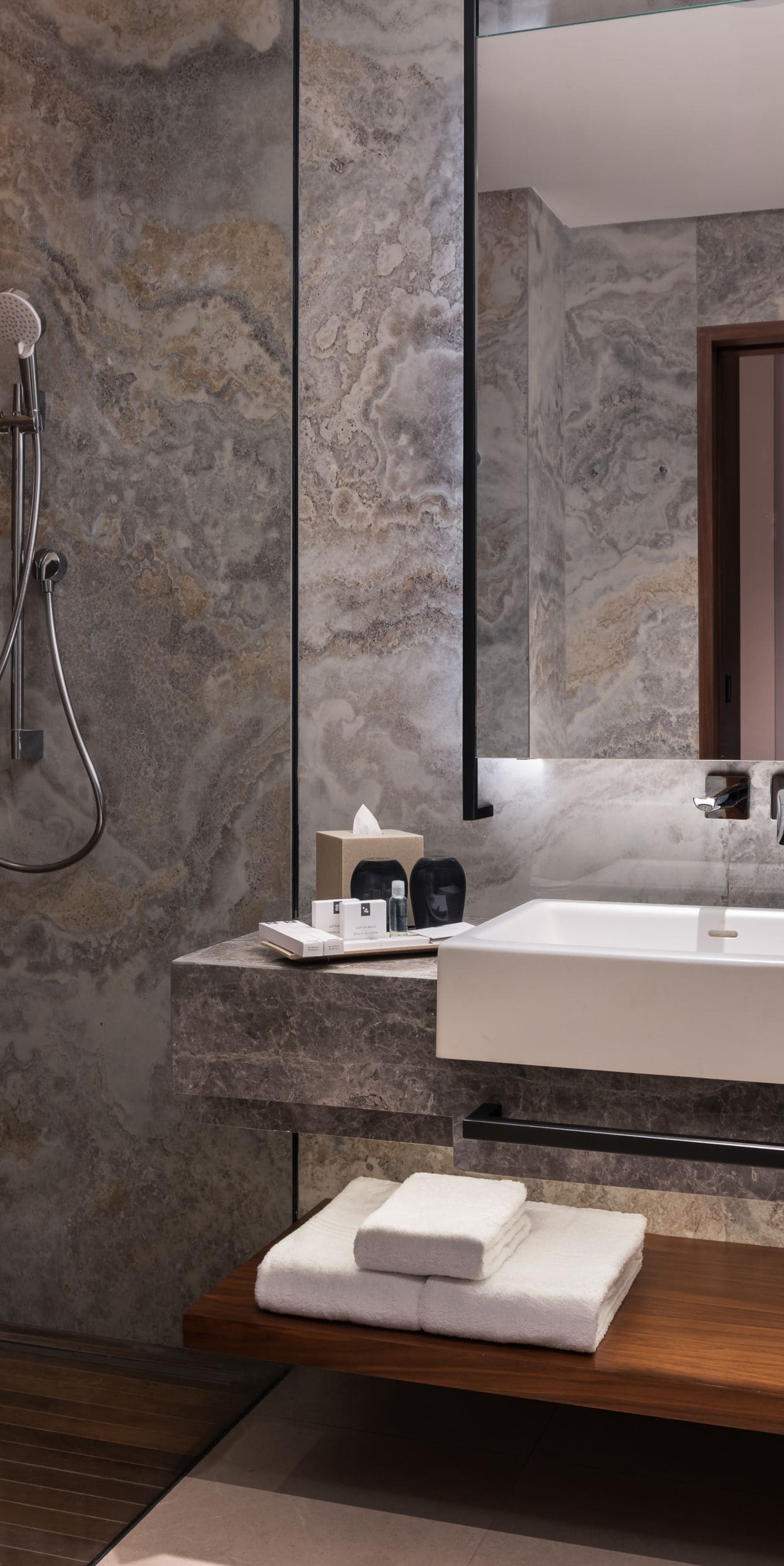 Bathroom with marble and wood accents