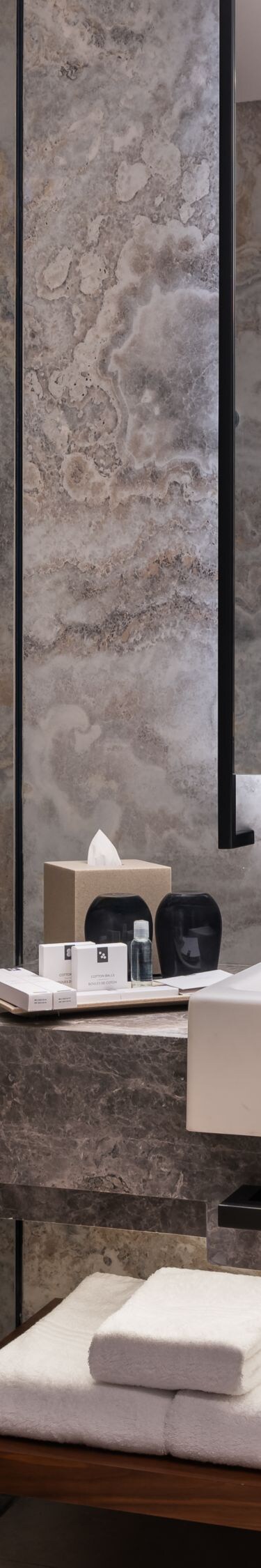 Bathroom with marble and wood accents