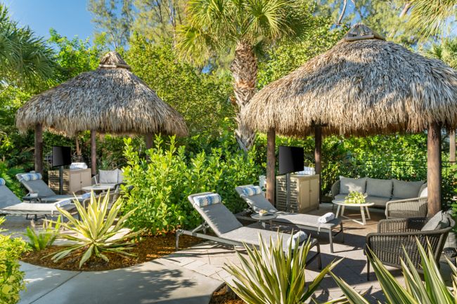 outdoor poolside cabanas and daybeds