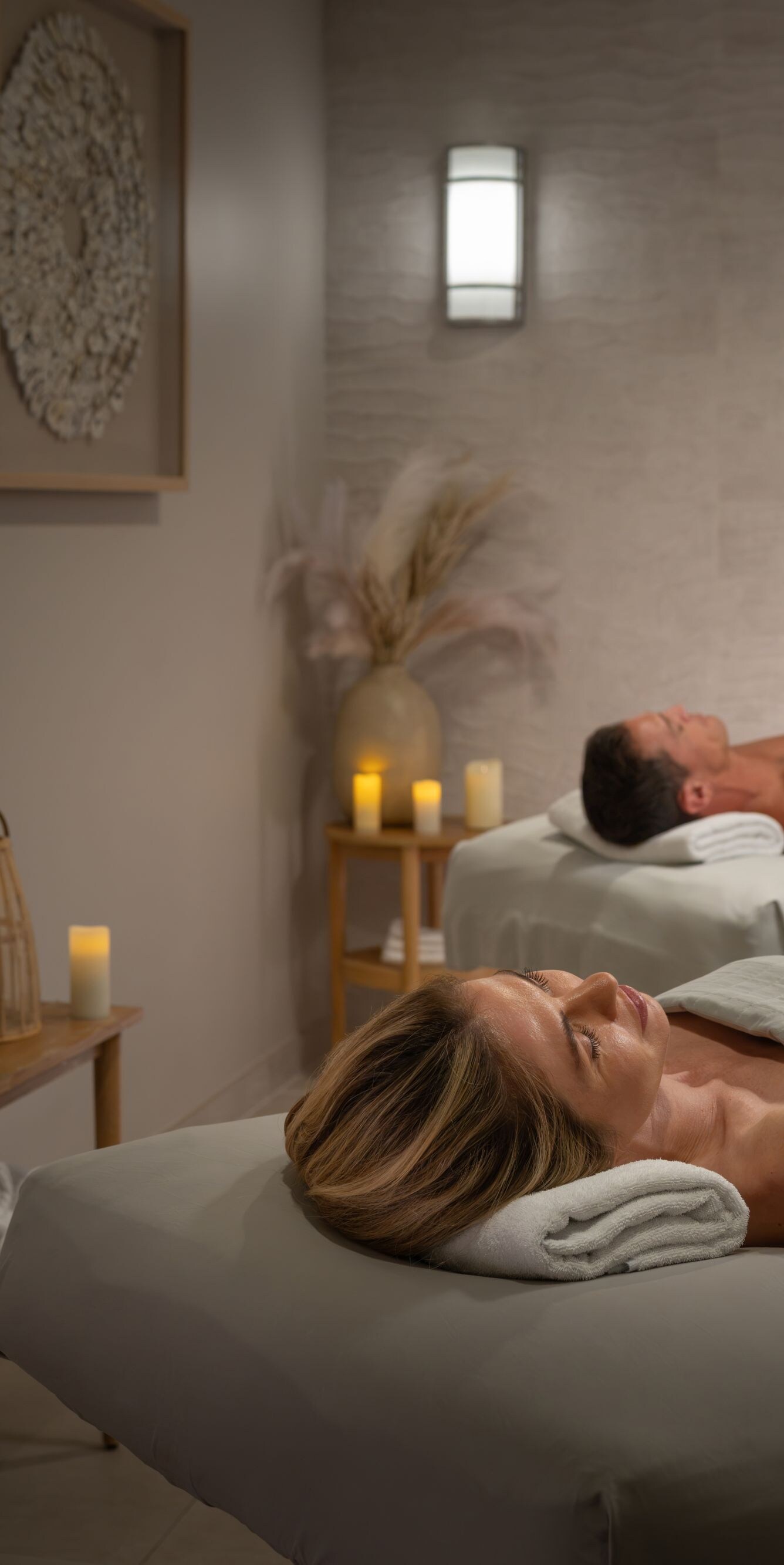 couple relaxing on massage tables