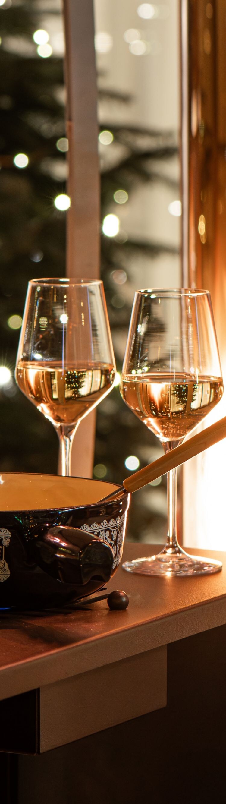 Enjoy a delicious fondue with a glass of wine