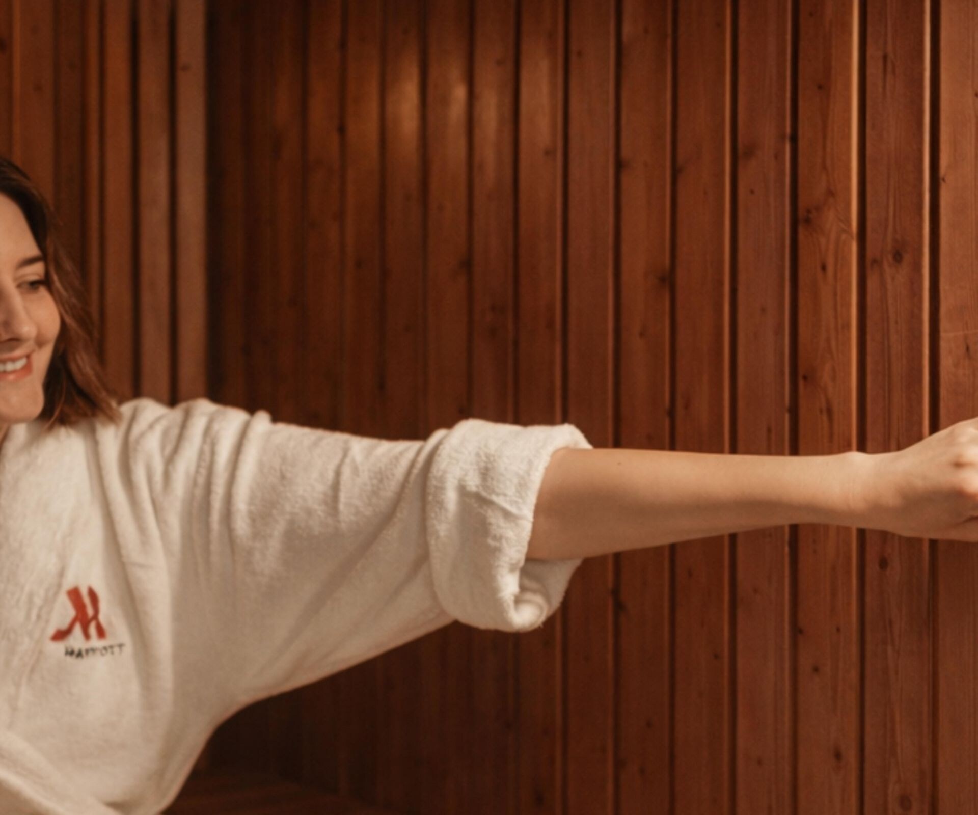 Woman relaxing in wooden sauna