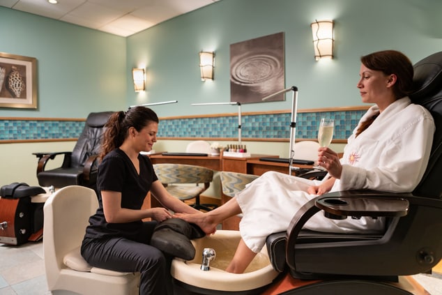 Spa worker giving a woman a pedicure