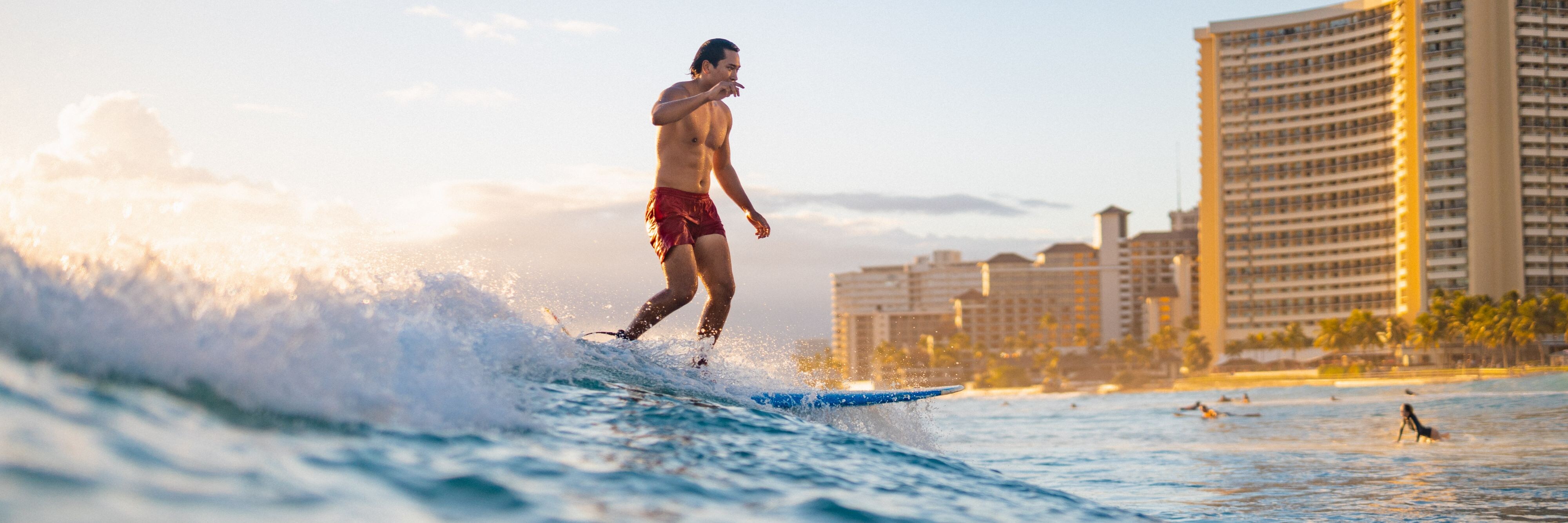 Ride the waves of the world-famous Waikiki Beach