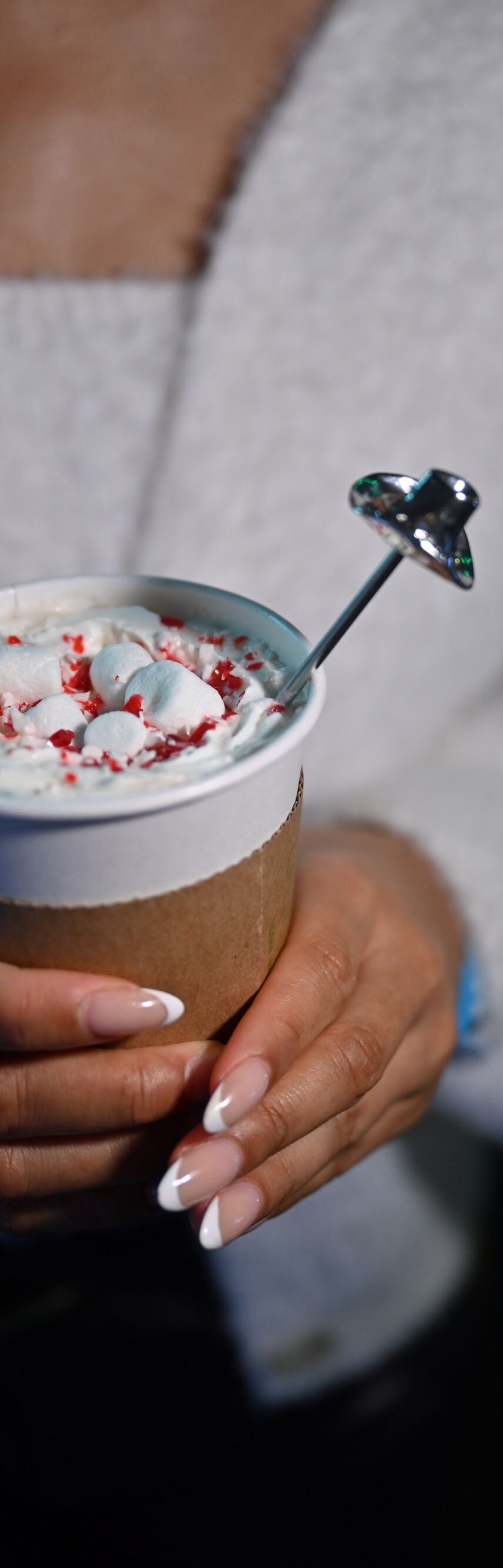 Hot drink with peppermint and marshmallow on top