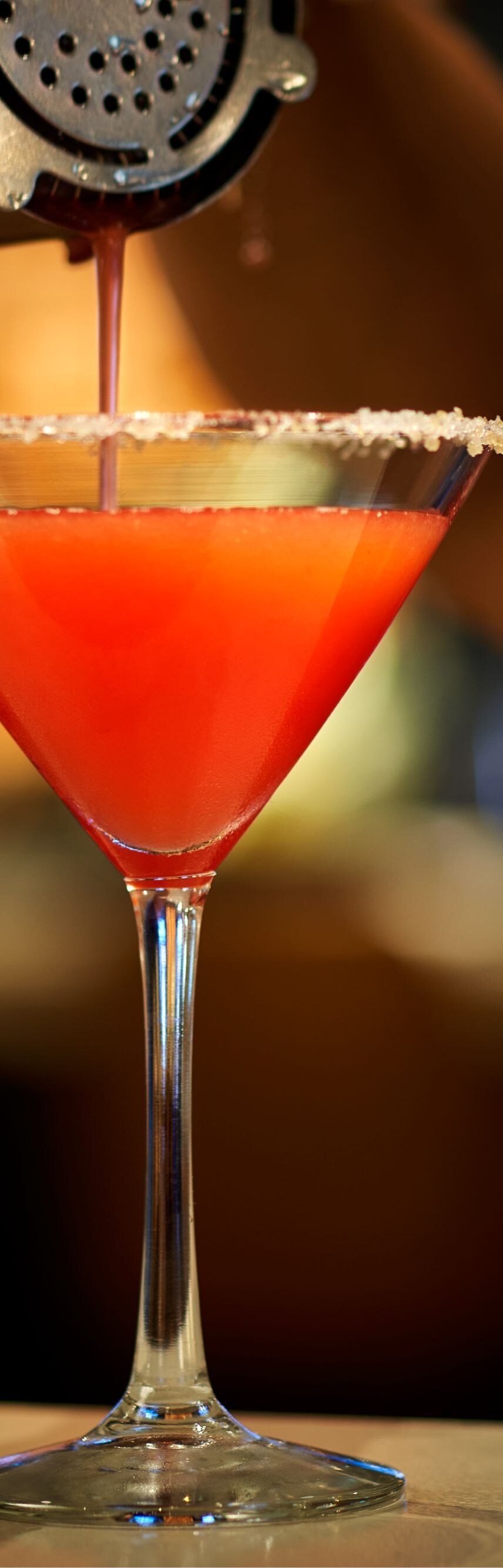 Signature cocktail being poured at Wellingtons