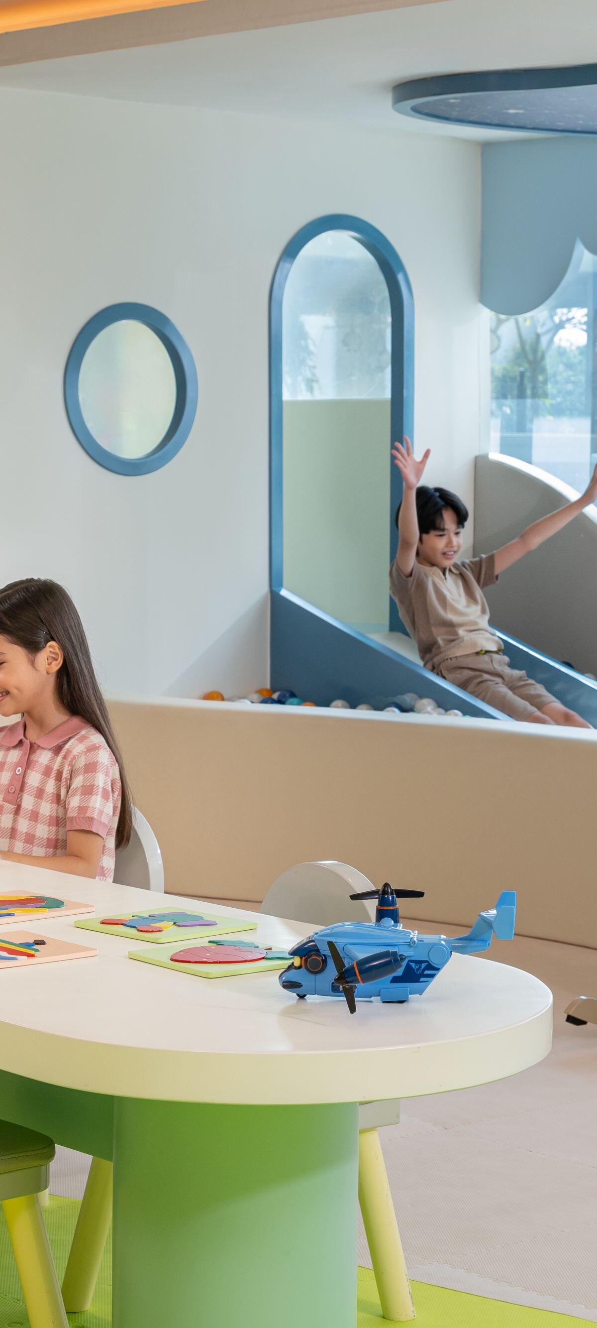 Children happily playing at a colorful kids club 