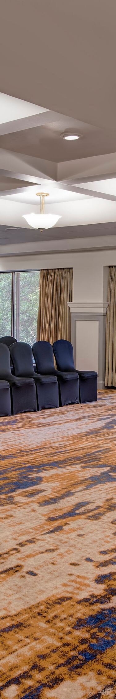 Conference room with chairs and podium by windows