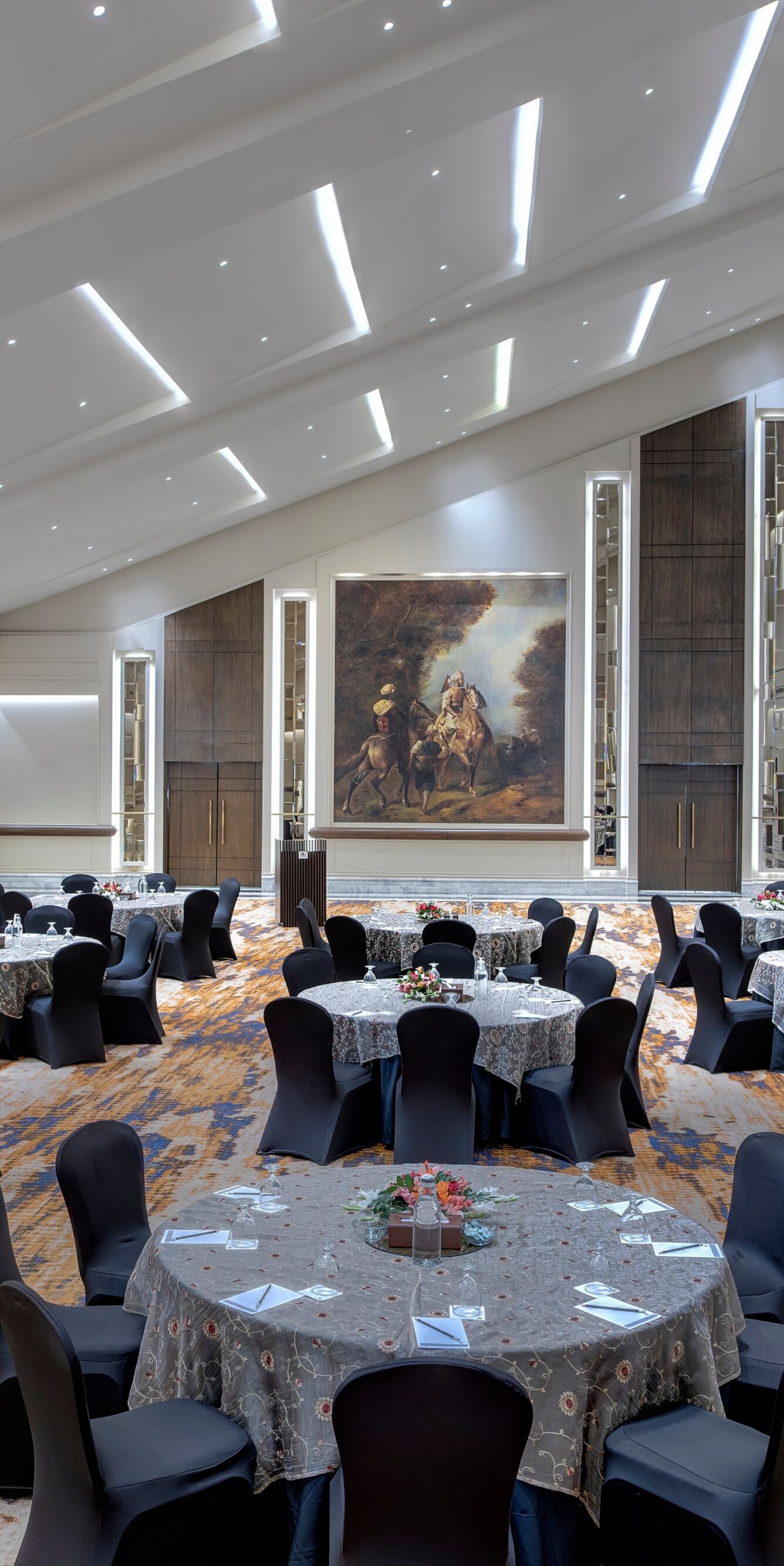round tables with chairs and vaulted ceiling