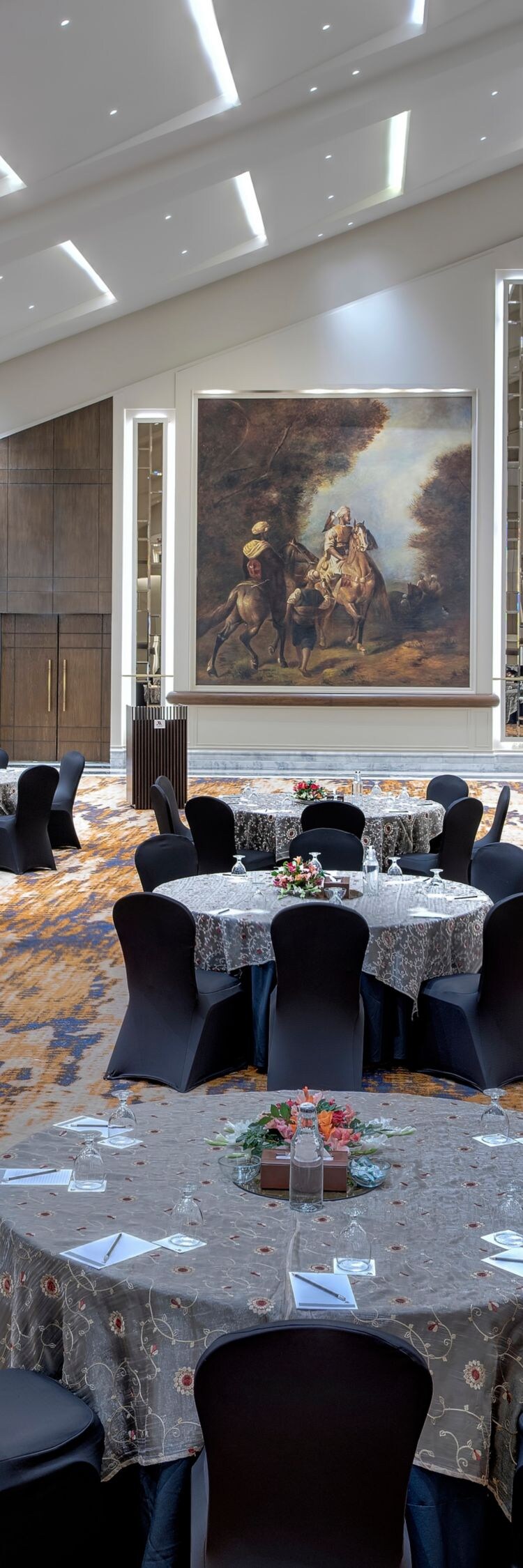 round tables with chairs and vaulted ceiling